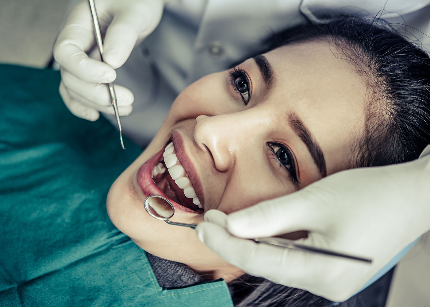 Smiling woman having a dental exam